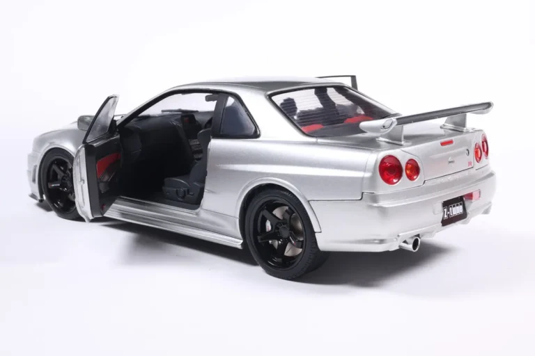 NISSAN SKYLINE GT-R (BNR34) WITH NISMO PARTS SILVER 1999 miniature 1/18 Solido collection