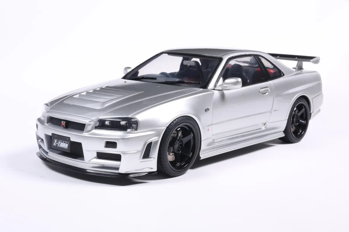 NISSAN SKYLINE GT-R (BNR34) WITH NISMO PARTS SILVER 1999 miniature 1/18 Solido vue avant gauche