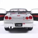 NISSAN SKYLINE GT-R (BNR34) WITH NISMO PARTS SILVER 1999 miniature 1/18 Solido vue arriere