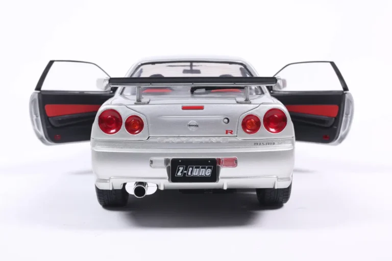 NISSAN SKYLINE GT-R (BNR34) WITH NISMO PARTS SILVER 1999 miniature 1/18 Solido vue arriere