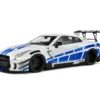 NISSAN GT-R (R35) W/ LIBERTY WALK BODY KIT 2.0 WHITE AND BLUE STRIPES 2024 miniature 1/18 Solido vue avant gauche