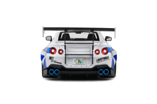 NISSAN GT-R (R35) W/ LIBERTY WALK BODY KIT 2.0 WHITE AND BLUE STRIPES 2024 miniature 1/18 Solido vue arriere